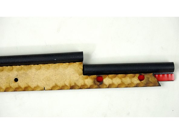 Flip over the Seal Bar and place the remaining P Gasket (With protective film still ON) under the lip of the bottom portion of the bar (Pic 1)