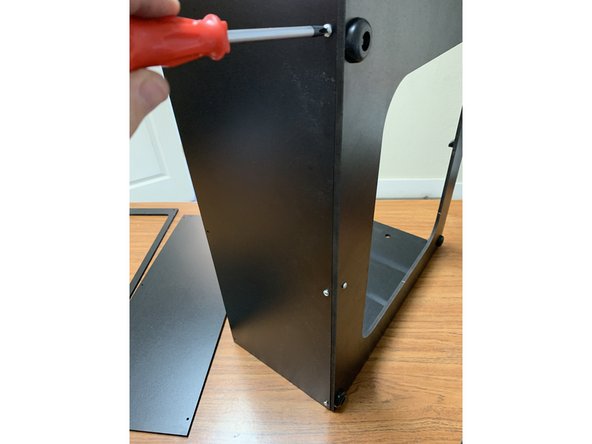 Once you've verified the panel is oriented properly, fasten it to the base assembly's brackets using 3 TF screws as shown.