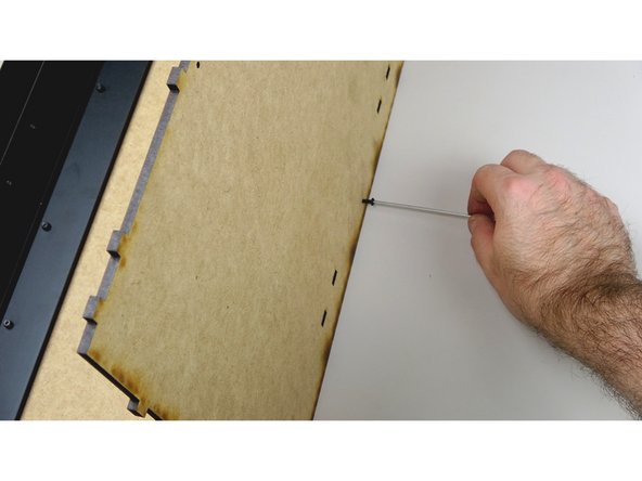 Carefully stand the whole assembly upright, with the base panel on the table.