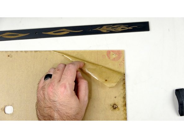 Carefully peel back the protective film to expose the top of the acrylic. Repeat for the back as pictured.