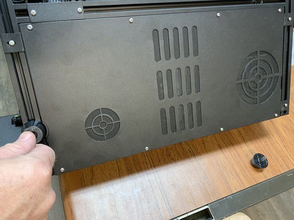 Remove the feet at the base of the unit by the electronics enclosure.