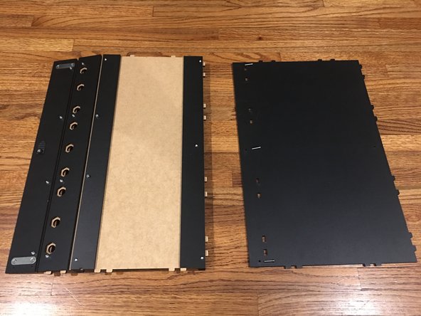 You will need the Rear Track Guide panel, Back Panel, and 16mm bolts for this step.