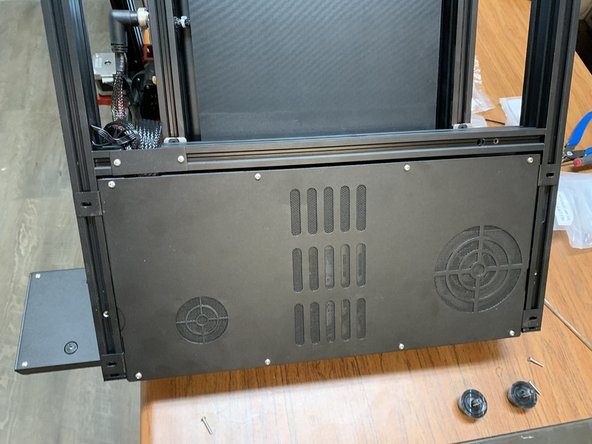 Remove the four screws holding the electronics tray to the frame.