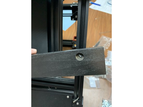 Use a hex key as shown to hold the slide nuts in the bottom of the side frame and line up the outer most cleat hole making sure the pointed end of the cleat is facing down.