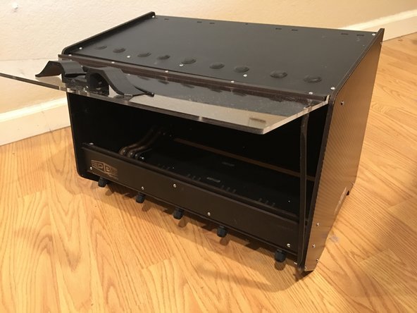 Press square nuts into the sides of the base handle and bolt to the acrylic using either 10mm bolts (if you have an earlier kit that uses them) or 16mm bolts.