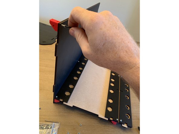 Notice that the bracket does not line up flush with the base of the rear panel. This is intentional.