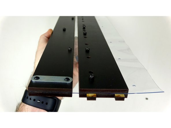 Place the Inner Exit Plate on top of the vinyl, being careful to line up the bolts with the holes as pictured.