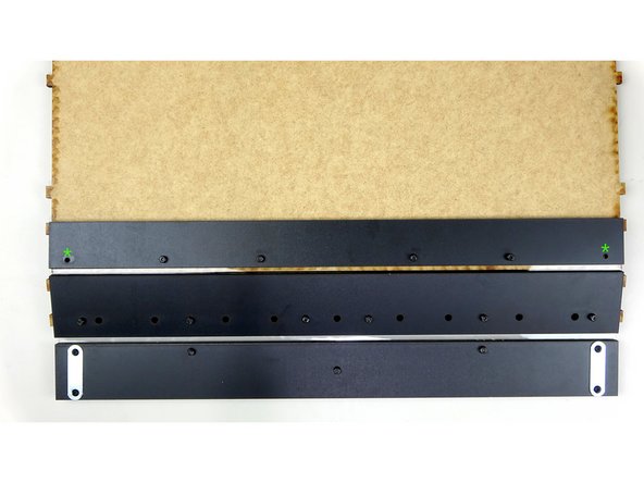 Take the Face assembly, constructed in STAGE 1, and with it FACE DOWN (logo facing down) start pushing the bolts through the vinyl hinge. The vinyl should help keep the bolts in place for the next step as you push them through.