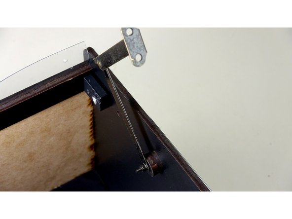 Tighten down just enough to make contact with the arm. Do NOT tighten to the point the arm does not move.