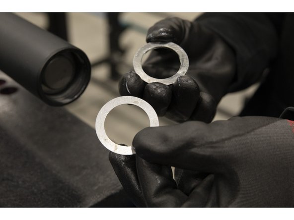 Apply grease to one full washer and one shim washer.