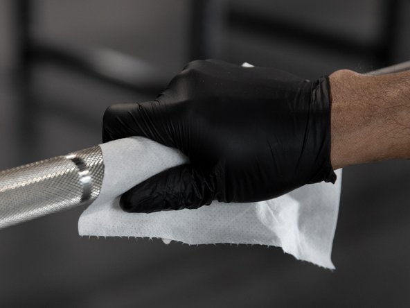 Wet the shaft with an alcohol free, phenol free, bleach free, and ammonia free cleaner or wipe containing an EPA approved disinfectant designed specifically for cleaning gym equipment, such as GymWipes Antibacterial.