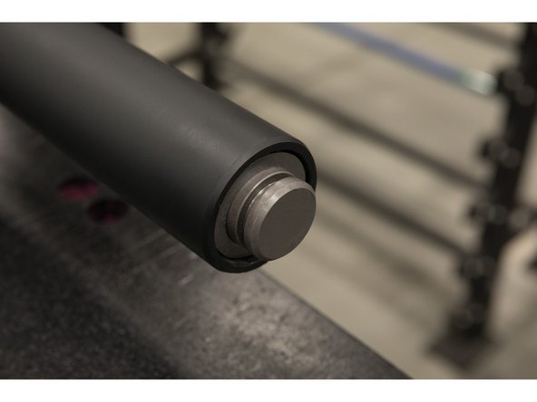 Slowly slide until the bar shaft groove fully protrudes through the sleeve end.