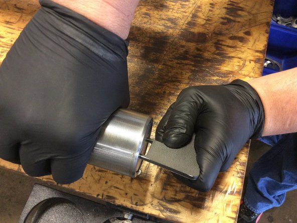 Place end cap on sleeve. Use tool to screw end cap in place by rotating sleeve counter clock wise.