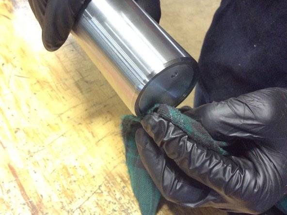 Use a towel to clean excess loctite around end cap.