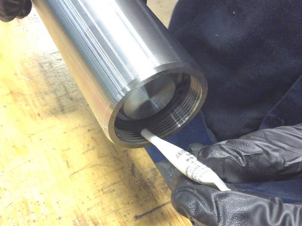 Open Loctite 648 kit, snap tube neck below cap.