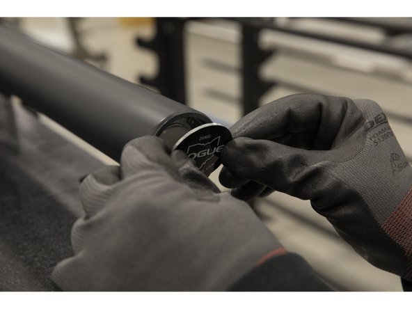 Place the end cap into the sleeve end and push it up against the inner snap ring.