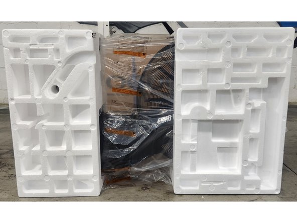 Remove all of the components packaged on the outside of the foam clamshells.  The components are secured to the foam using packing tape.  Use a box knife to cut the packing tape.  Be careful to not damage the foam during component removal.  Sit the components to the side.
