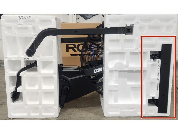 Insert the front stabilizer(without turf tires) into the right side of the clamshell in the spot shown in the picture.  Secure using 2 pieces of packing tape.