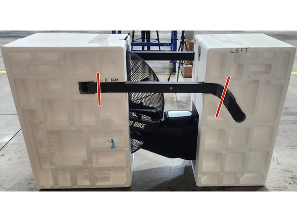 Insert the right arm into the left side of the clamshell.  Secure using 2 pieces of packing tape.