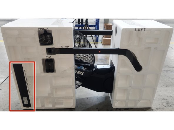 Insert the rear stabilizer into the left side of the clamshell in the spot shown in the picture.  Secure using 2 pieces of packing tape.