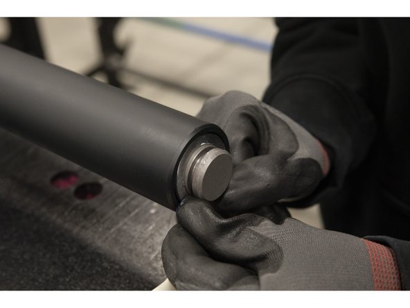 Slide the washer over the bar past the groove.