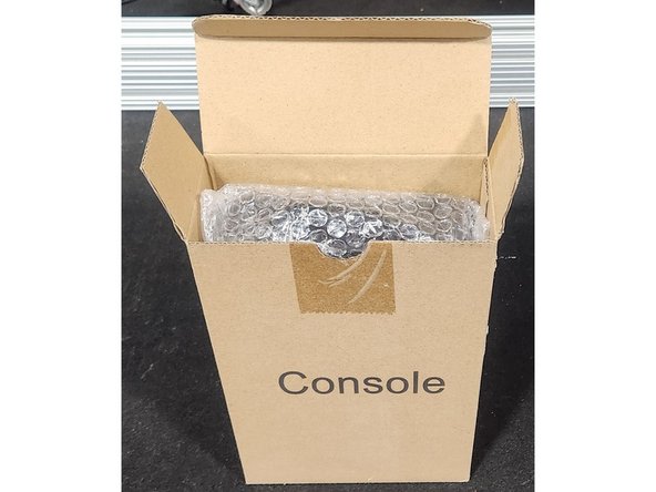 Insert the console into the console box.