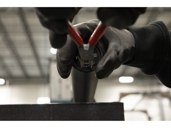 The snap ring must fully sit inside of the inside-most groove (adjacent to the last washer).