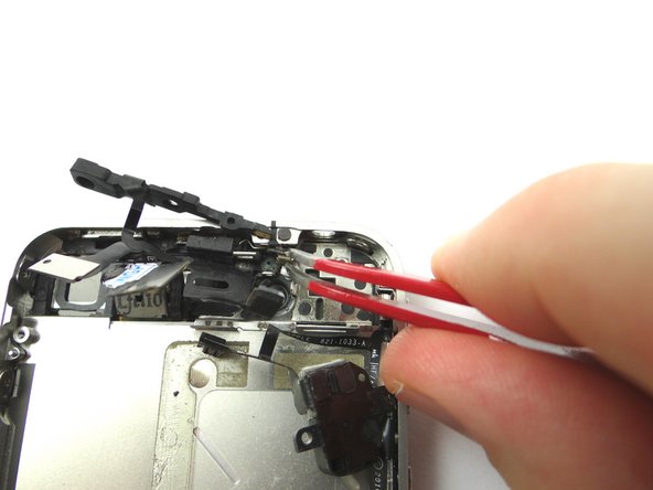 Picture 2: Secure the microphone to the mid-frame using Curved Tip Tweezers.