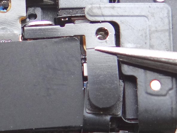 Picture 1: Remove the 1.5 mm Phillips Screw holding the Antenna Shield.  Place in SLOT 7.