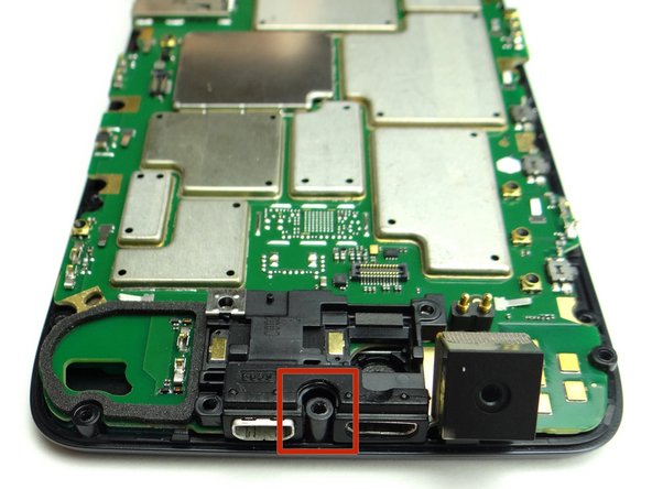 Pictures 1 &amp; 2: Feed the standoff at the top of the display through the notch at the top of the logic board.