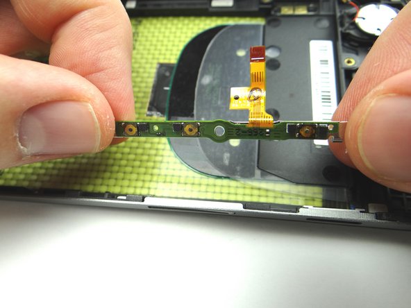 Picture 2: Peel away volume &amp; power button board.  Place in COMPARTMENT E.