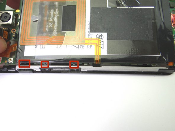 Picture 2: Make sure the power and volume tabs on the logic board align with the sockets on the display assembly.