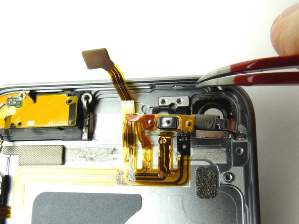 Use tweezers to seat the power button.