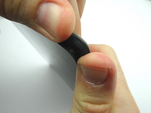 Picture 3: Insert a blue pry tool along the top edge between the display assembly and rear case.