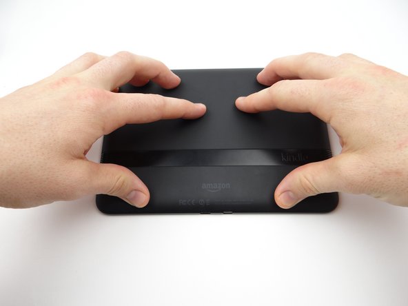 Push battery cover back onto Kindle.