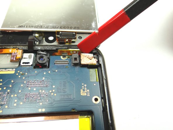 Picture 3: Use Black Spudger to lift rear camera until it's just above the logic board.