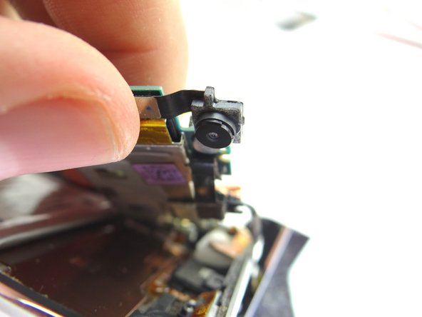 From COMPARTMENT C, connect the rear camera to the logic board.