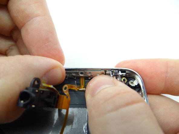 Seat the volume bracket, mute bracket and headset jack.