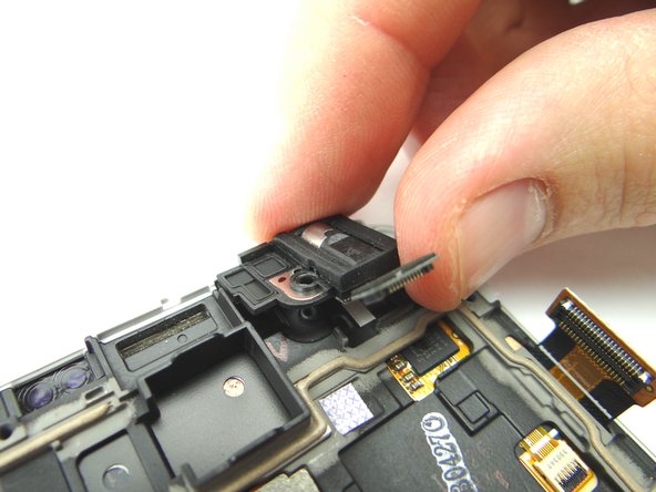 Use your fingers to remove the headphone jack and place into COMPARTMENT F.