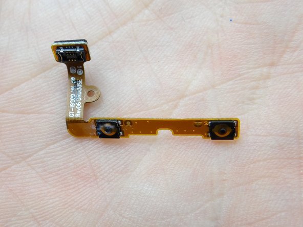 Place the volume rocker cable in COMPARTMENT E.