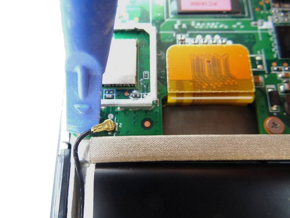 Use the blue pry tool to disconnect the antenna cable head.