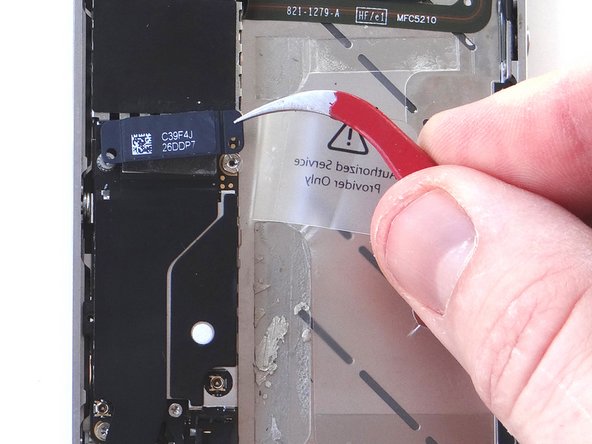 Then lift the charging port assembly shield straight up with your fingers (or tweezers, if necessary).  Place the charging port assembly shield with screws in SLOT 8.