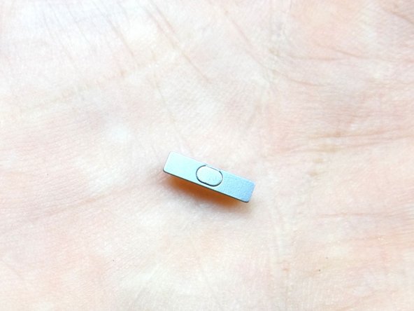 Use metal tweezers to remove power button.  Place in COMPARTMENT E.