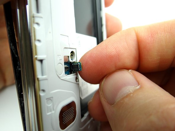 Pictures 2 &amp; 3: Push home button cable through mid-frame so it moves freely with the screen.