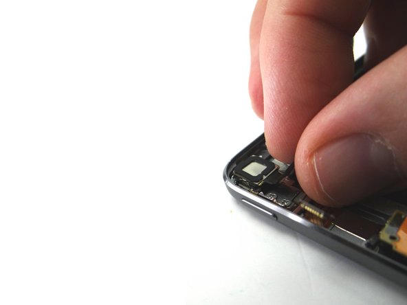 Pictures 1 &amp; 2: Peel up the camera cable then use the blue pry tool to remove the camera from its socket.  Place in COMPARTMENT B.