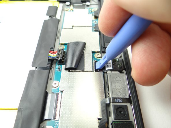 Picture 1: Use the blue pry tool to open front-facing camera ZIF connector.