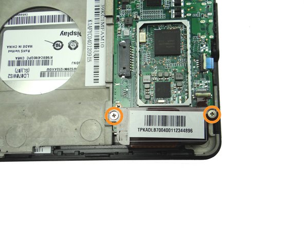 Picture 1: Remove two 2.3 mm Phillips screws holding down the digitizer cable.  Place in SLOT 2.