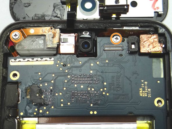 Picture 1: Remove two 2.3 mm Phillips screws and place into SLOT 7.