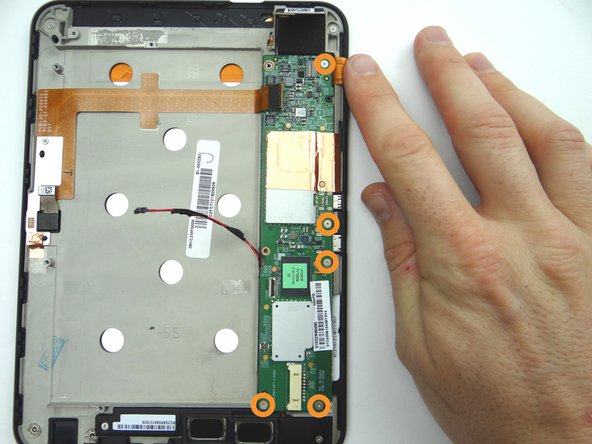 Picture 1: Remove five 3.2 mm #00 Phillips screws holding down logic board.  (Note the hidden screw in the upper-right hand corner).  Place in SLOT 6.