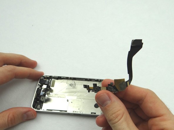 Use your fingers to remove the charging port once it's loose.  Place charging port in ZONE IV.